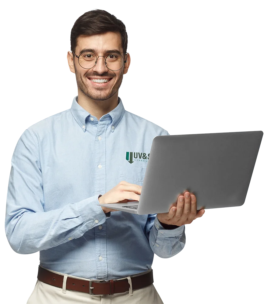 Business IT support specialist using a laptop