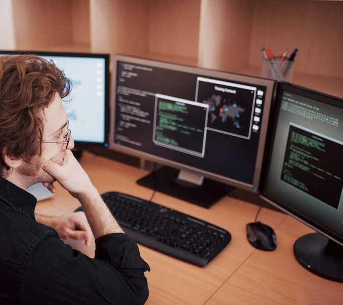 IT specialist implementing a technology solution across multiple computer systems.