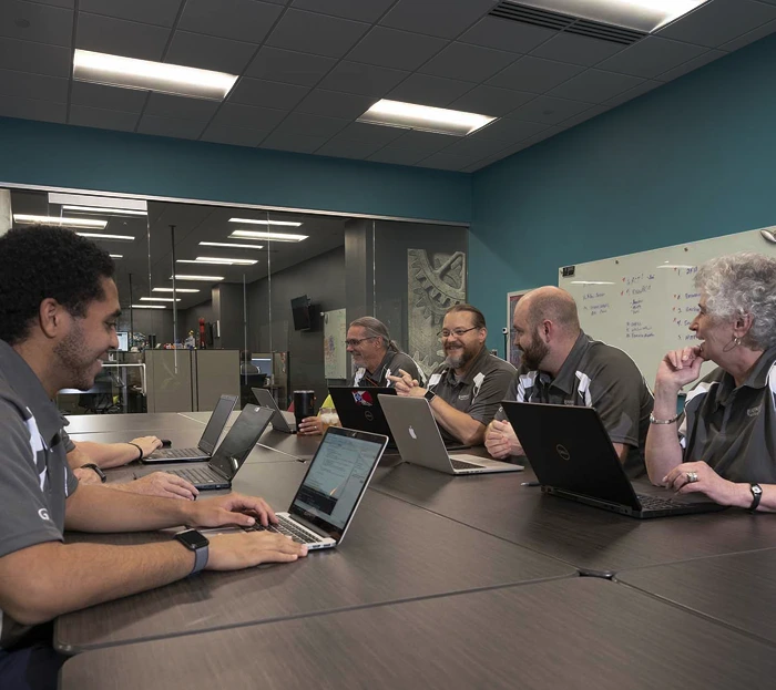 IT professionals collaborating to design a customized technology solution.